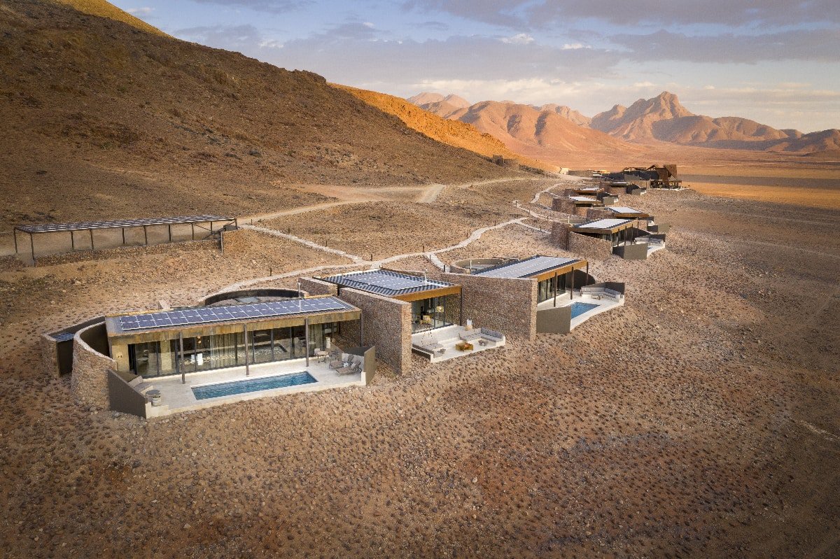Aerial view of the Star Dune Suite with the other suites curving back around the desert landscape - &Beyond Sossusvlei Desert Lodge, Namibia