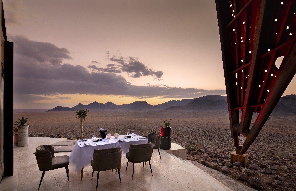 Outdoor dining area at dusk -- Sossusvlei Desert Lodge, Namibia