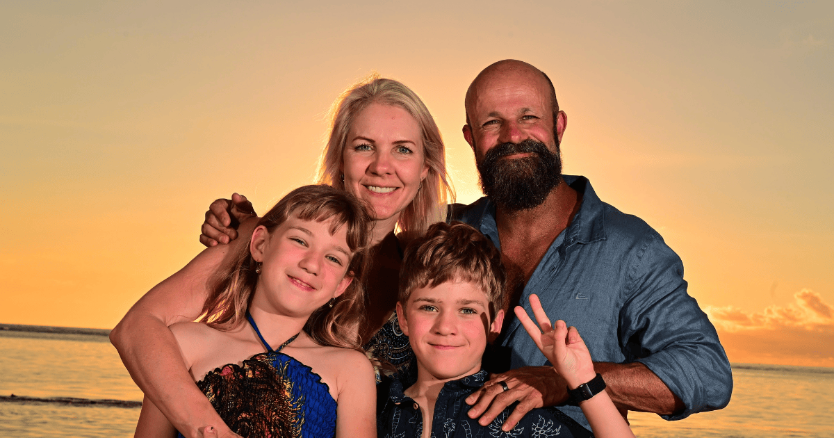 Ilze and her family enjoying a beach sunset